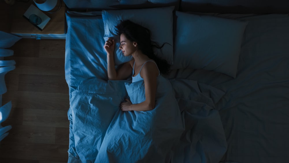 Women sleeping soundly in bed